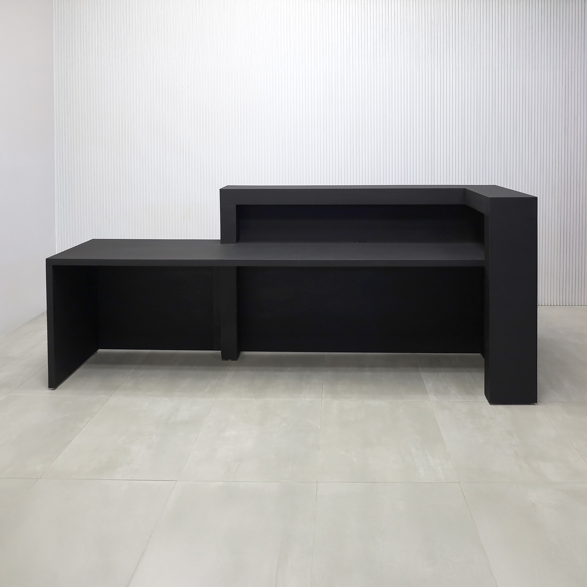 108-inch New York L ADA Reception Desk with Black Cinder Matte laminate desk, Black Cinder matte laminate workspace, Black Cinder matte laminate front panel, and Warm White LED with remote control.