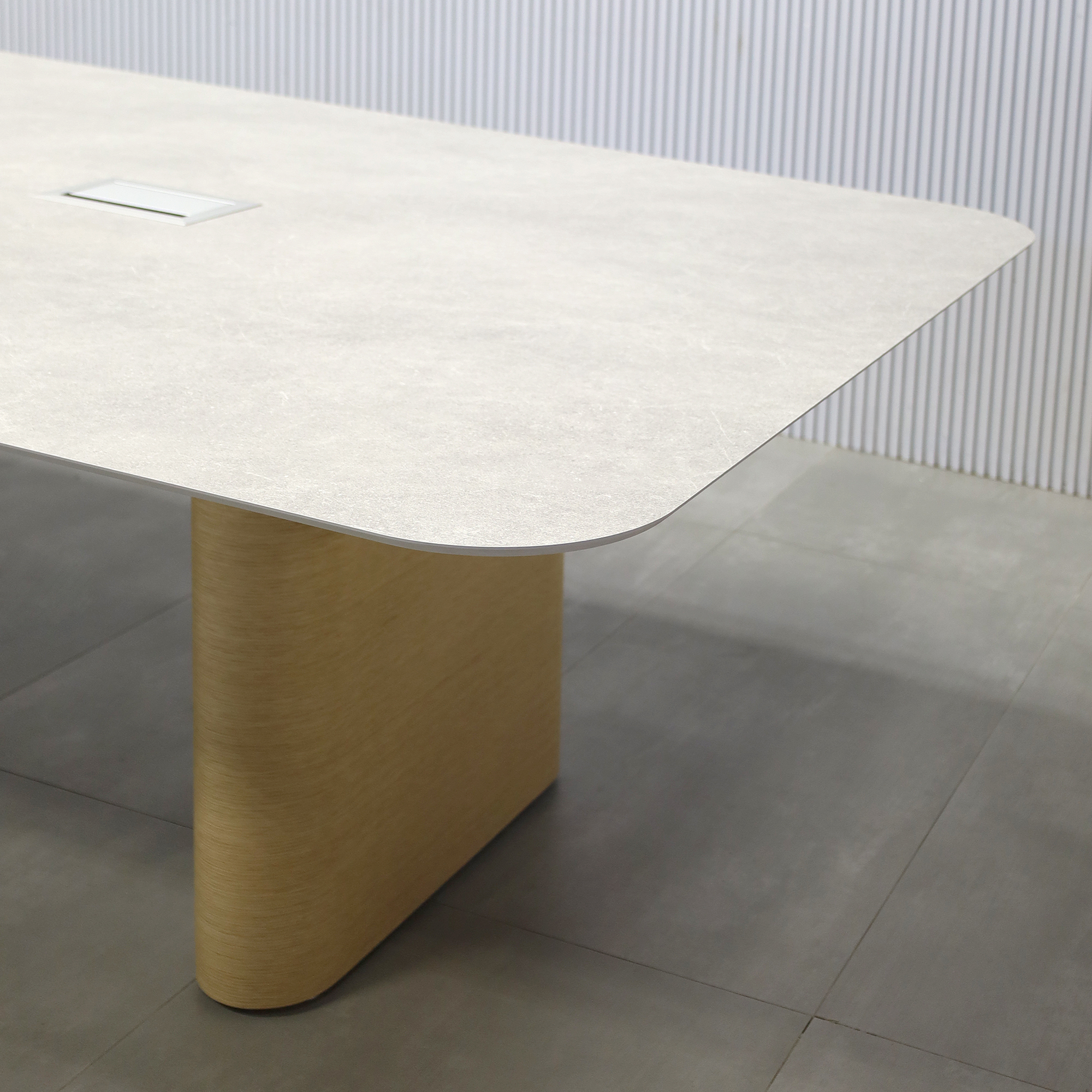 144-inch Aurora Racetrack Conference Table with 1/2" Positano engineered surface(Special Finish) top, White Oak veneer base, and two Silver Mx3 power boxes.
