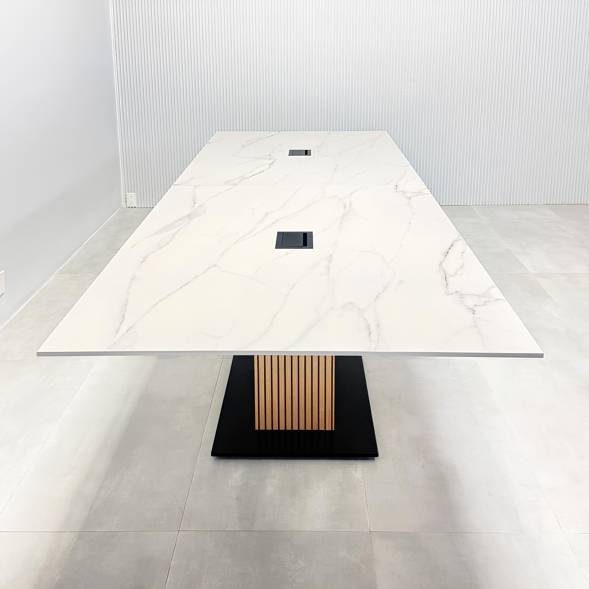 144-inch Aurora Rectangular Shape Conference Table with solenne marble engineered surface top, white oak tambour pedestal, metal powder coated in black, and MX3 power box in black.
