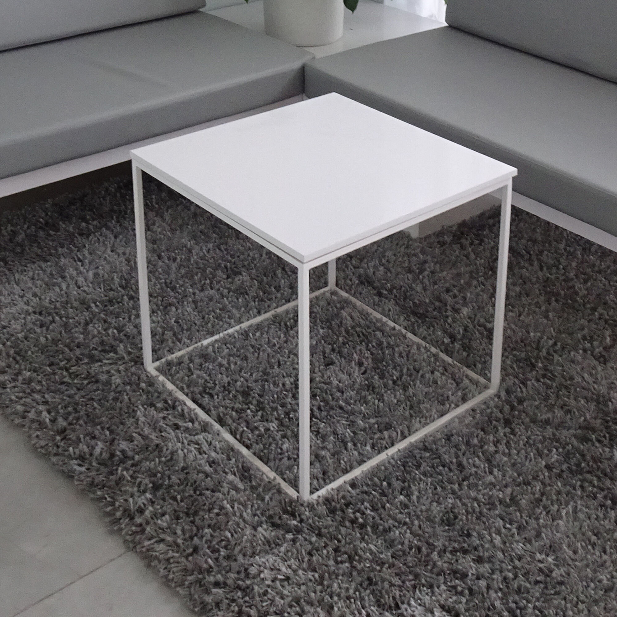 16-inch Aspen Square Side Lobby Table in 1/2" white solid engineered surface top and white metal frame, shown here.