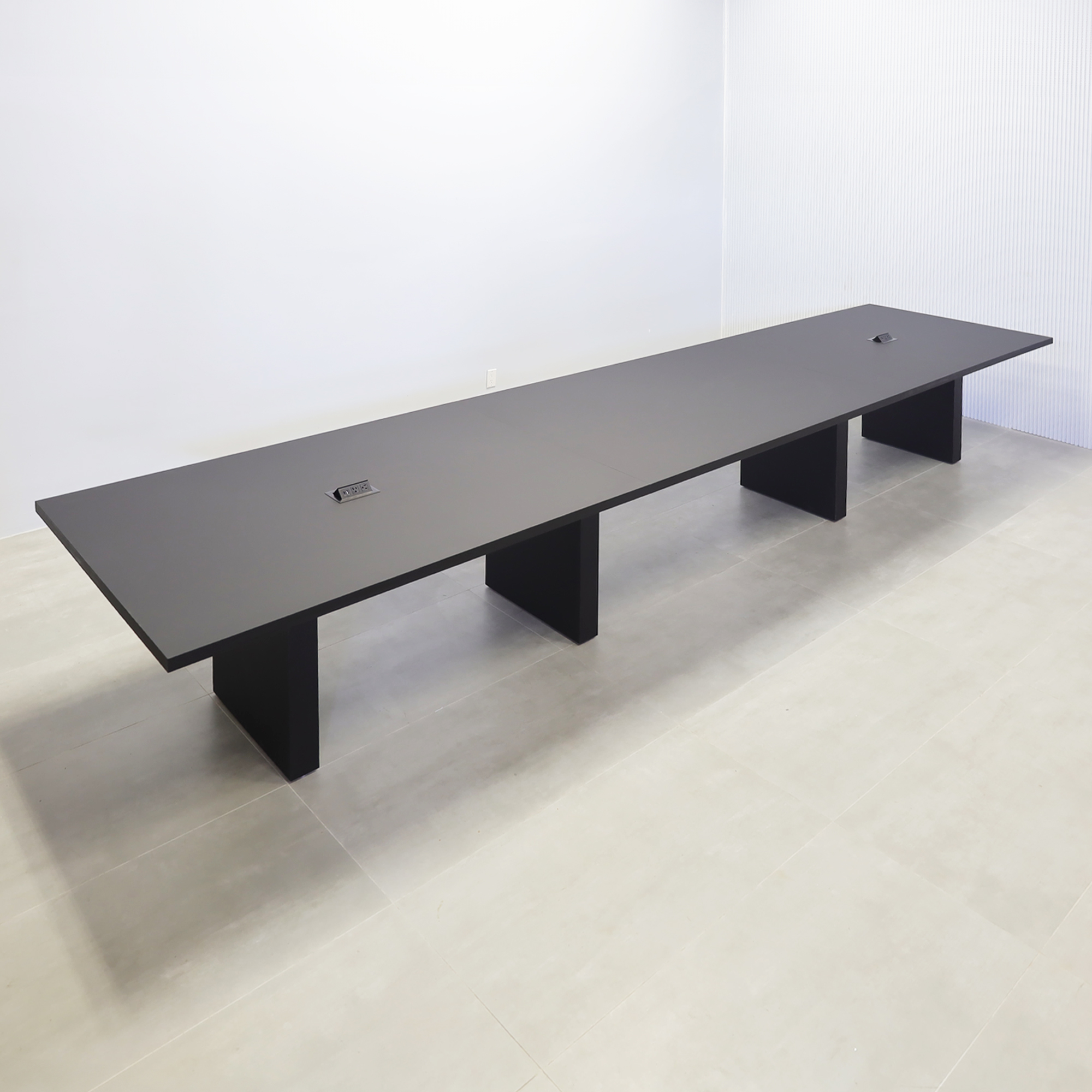 216-inch Newton Rectangular Conference Table with black traceless laminate top, black traceless laminate base, and black Mx2 power box.
