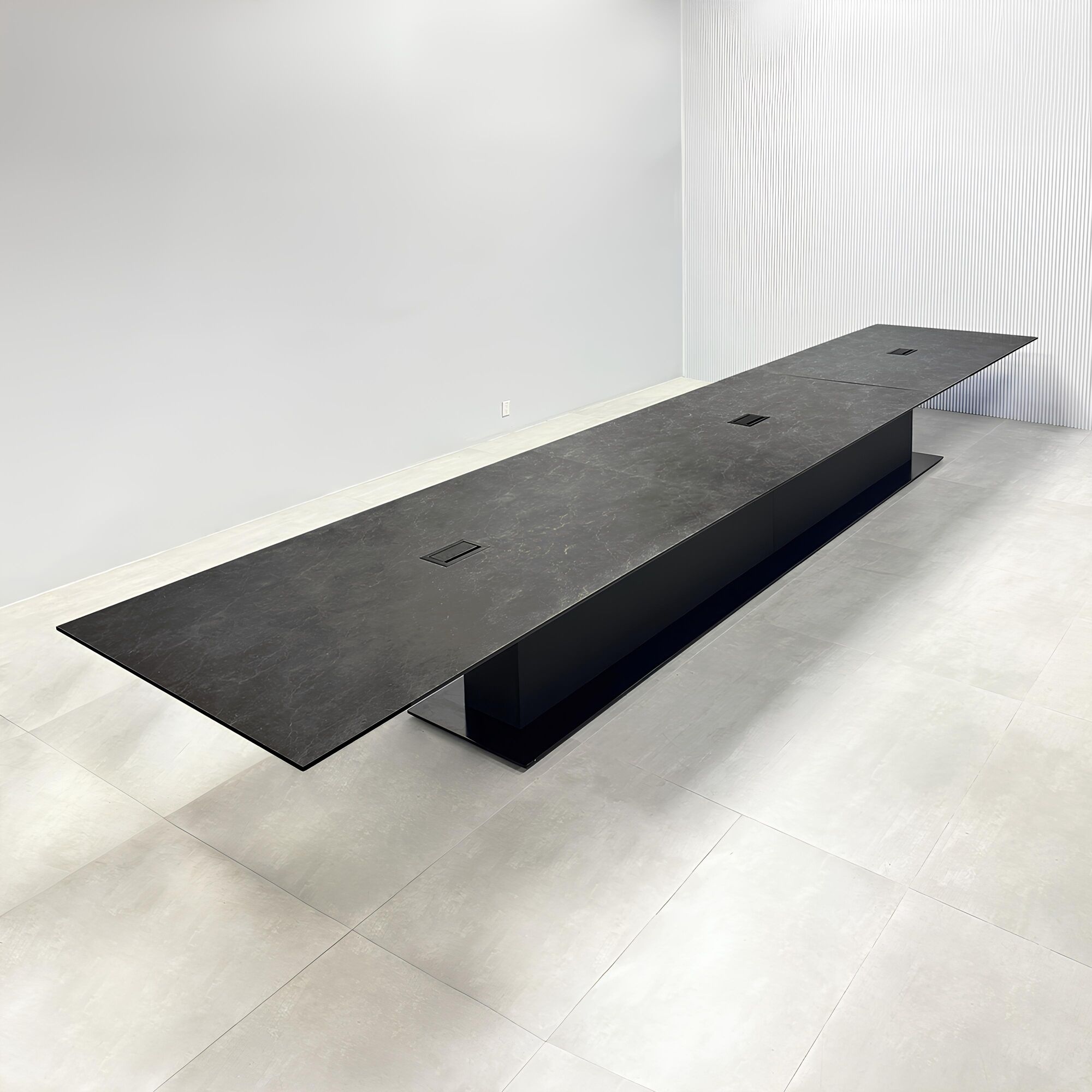 252-inch Aurora Rectangular Conference Table in black amani engineered surface top, black traceless laminate pedestal, metal powder coated black base, and Mx3 in black.