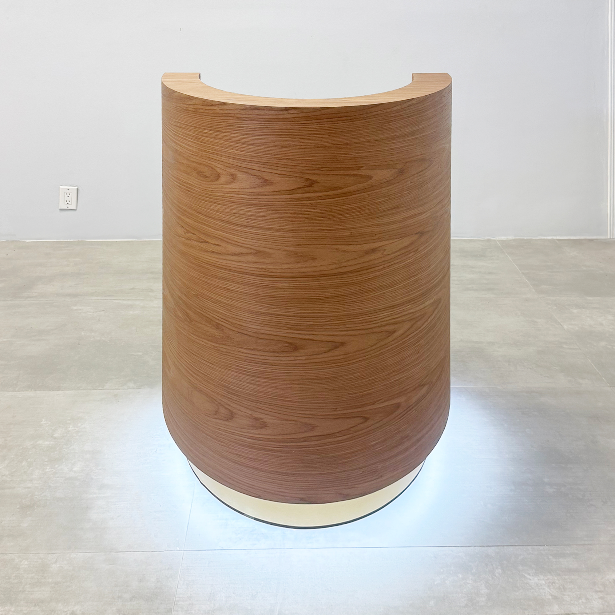 32"inch Lima Podium with Standard Walnut Wood Veneer main body, Standard Walnut Wood Veneer workspace, Gold Aluminum toe-kick, and White LED. 
