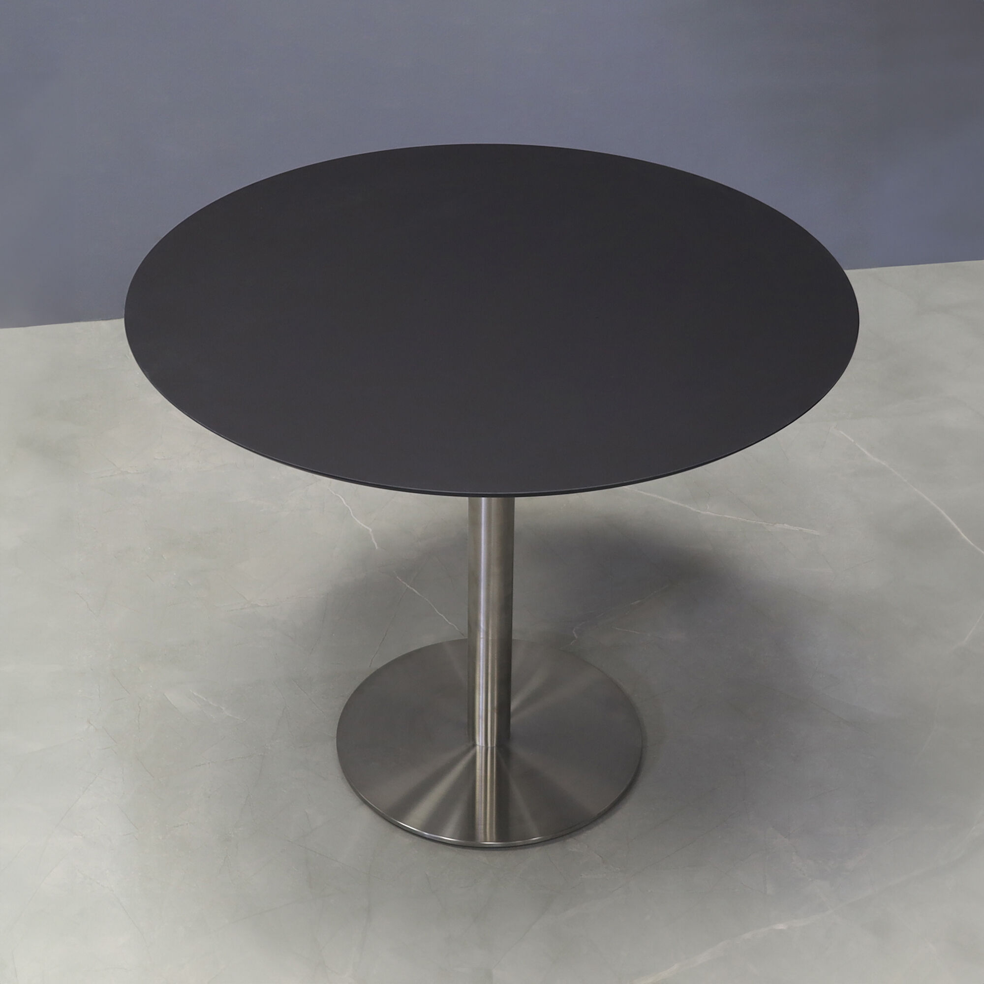 36-inch California Round Conference Table with 1/2-inch black traceless engineered surface top and silver metal powder-coated base.