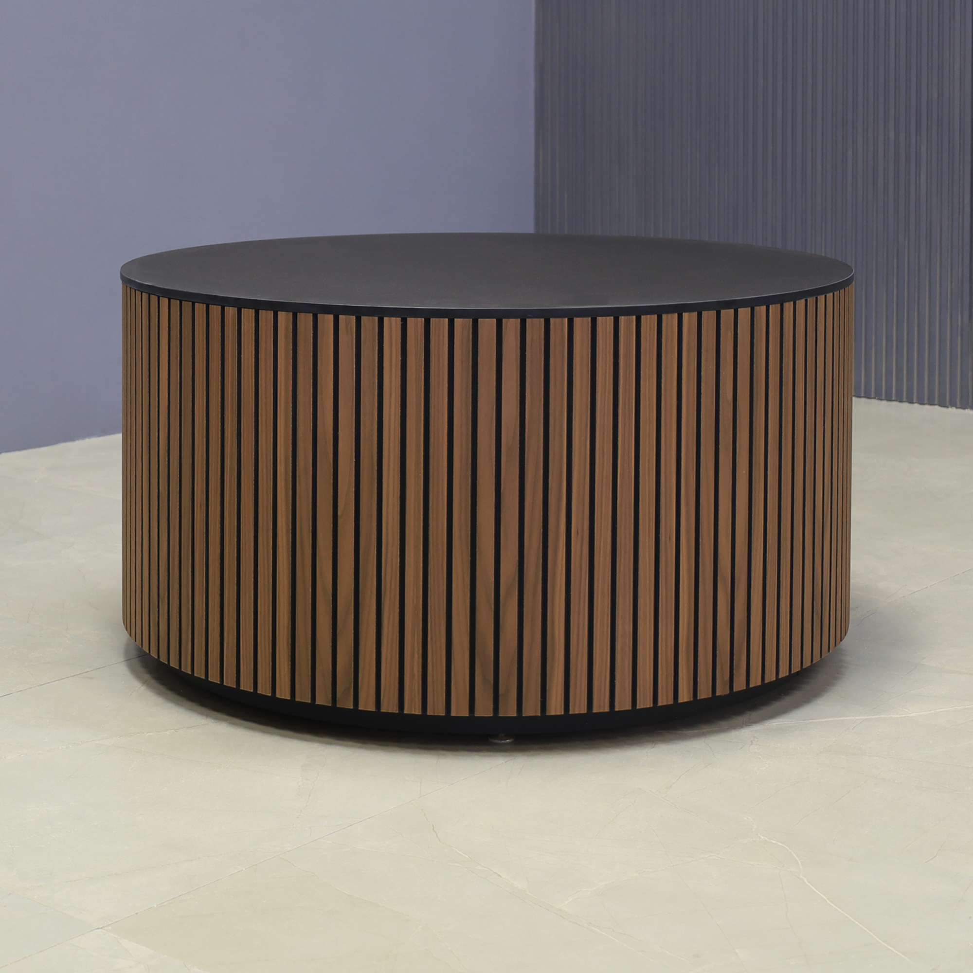 36-inch Nolrfolk Round Lobby Table in 1/2" black traceless engineered stone top, walnut tambour outside and black traceless laminate toe-kick, shown here.