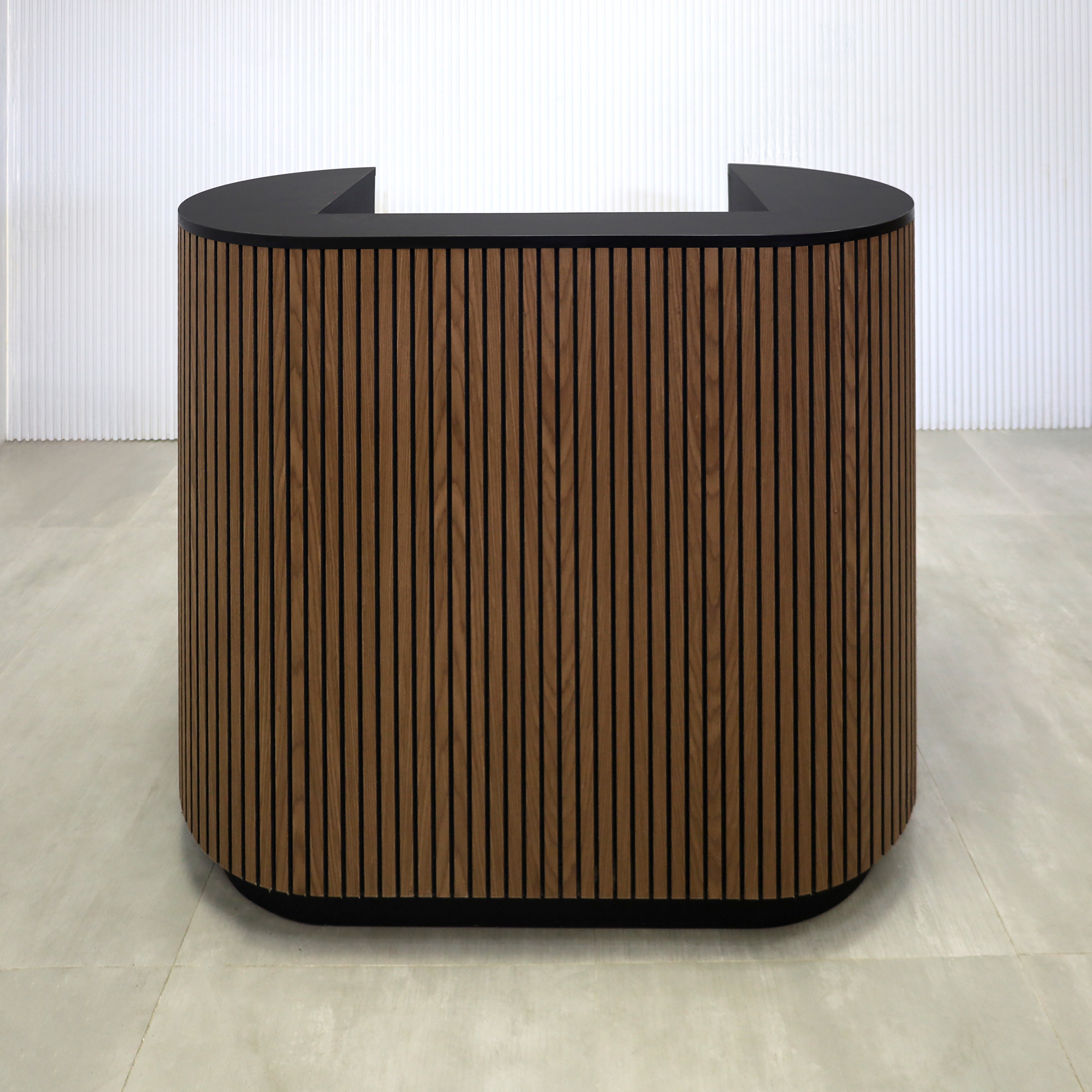 48-inch The Pill X2 Podium & Host Custom Desk with Walnut Tambour and Black background main body. Black Traceless laminate workspace and Top. Black Traceless laminate toe-kick.