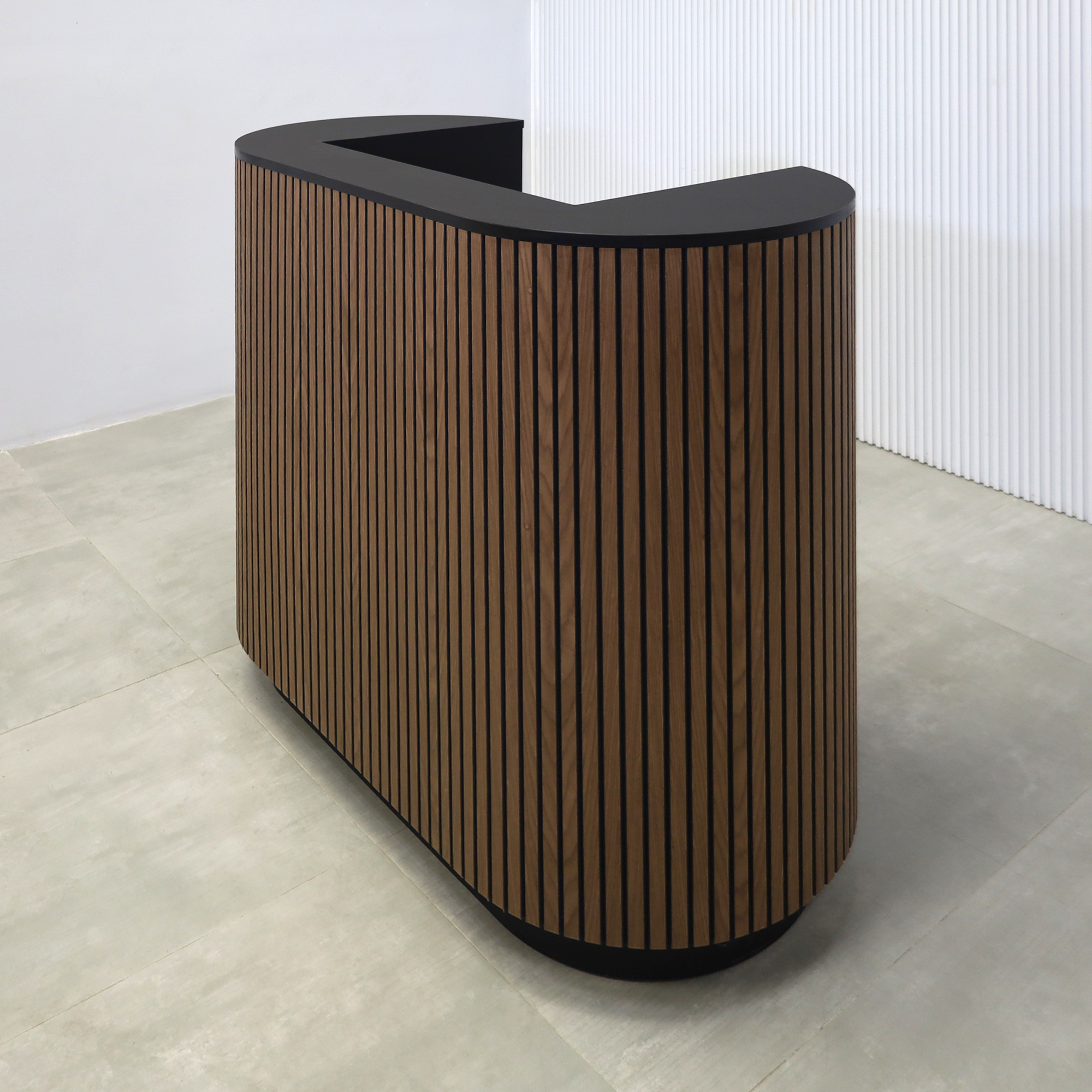 48-inch The Pill X2 Podium & Host Custom Desk with Walnut Tambour and Black background main body. Black Traceless laminate workspace and Top. Black Traceless laminate toe-kick.