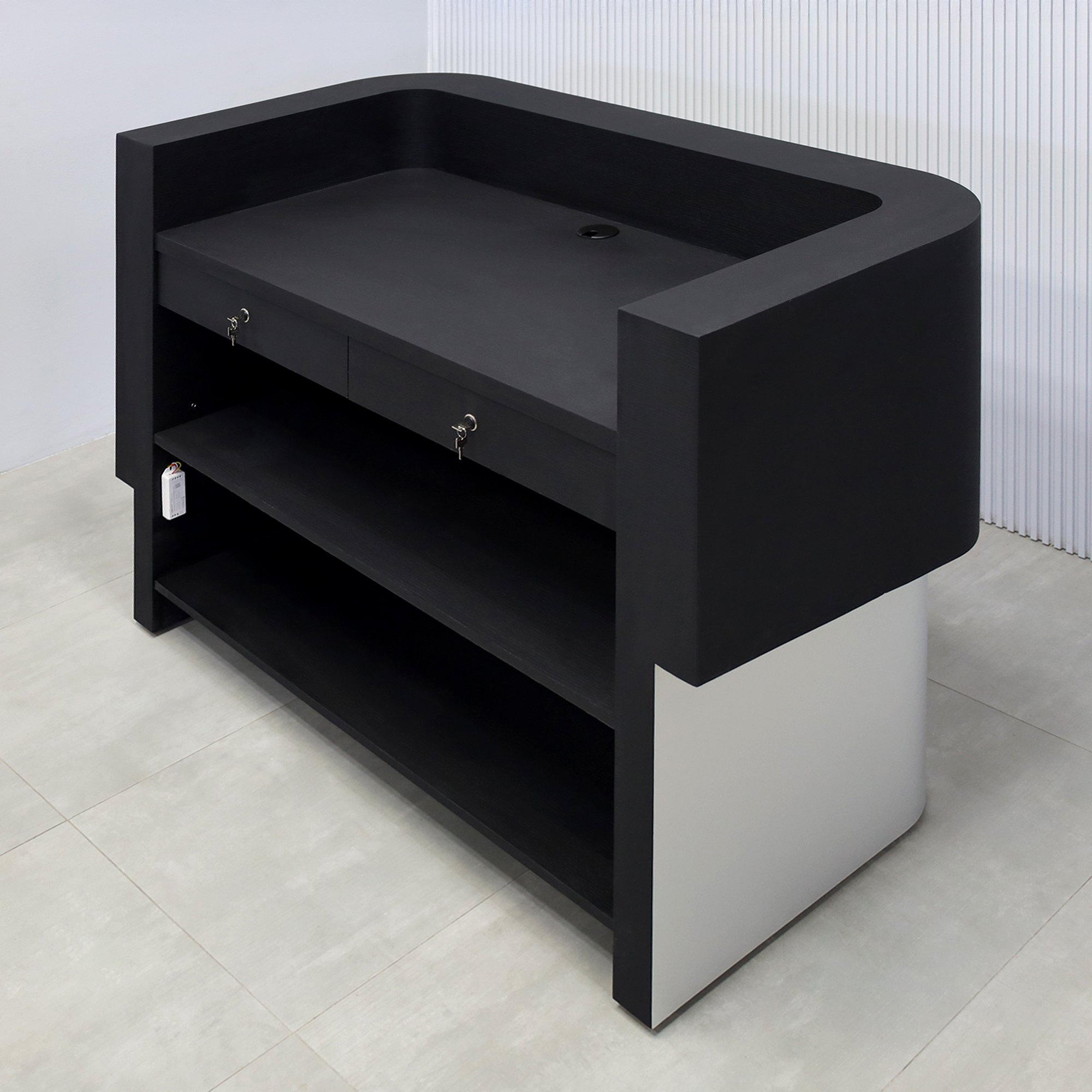60-inch Nola Curved Reception Desk with Black Cinder matte laminate counter, Black Cinder matte laminate workspace, Brushed Aluminum base, and White LED.