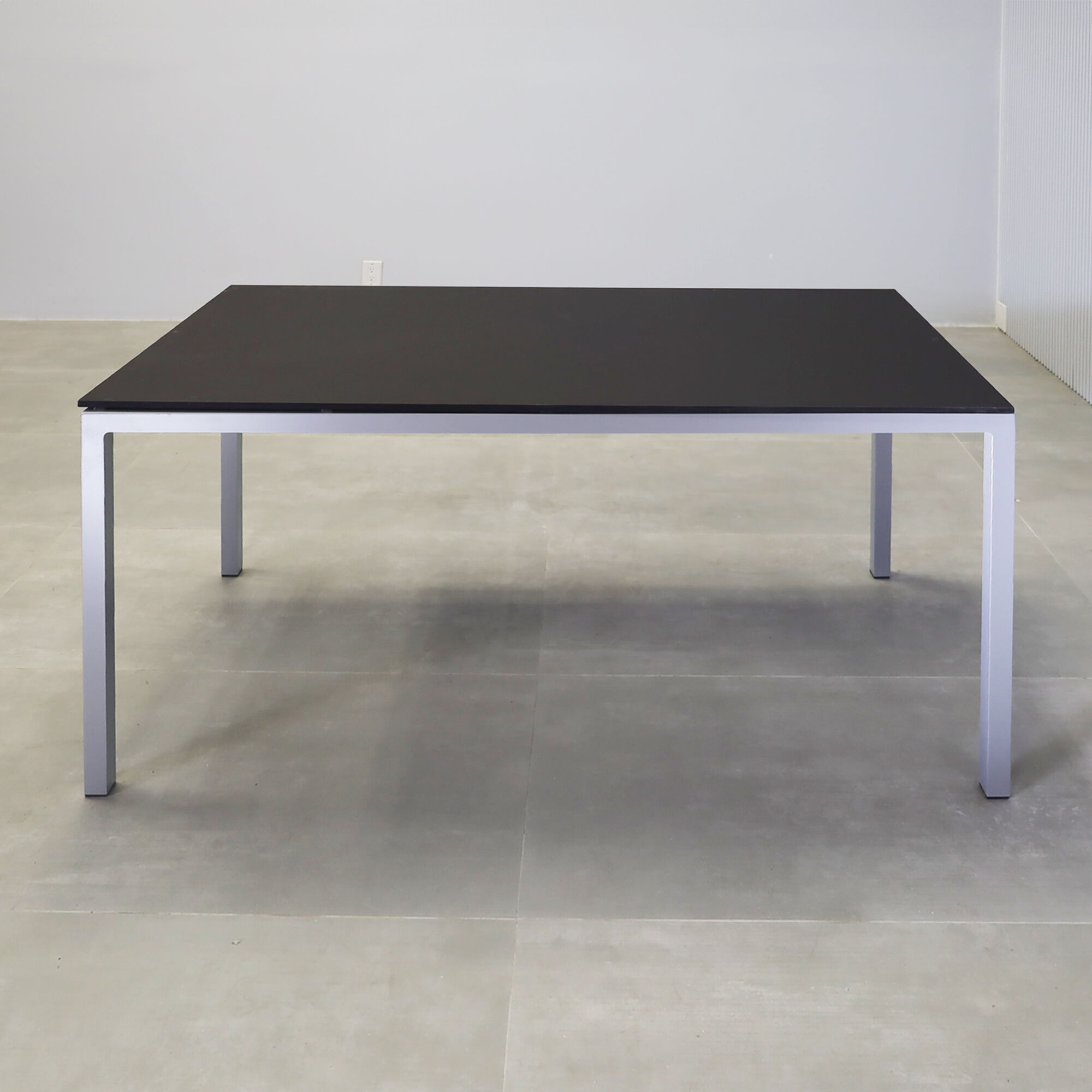 60-inch Aspen Rectangular Conference Table in 1/2" black traceless engineered surface top, and metal powder coated silver base.