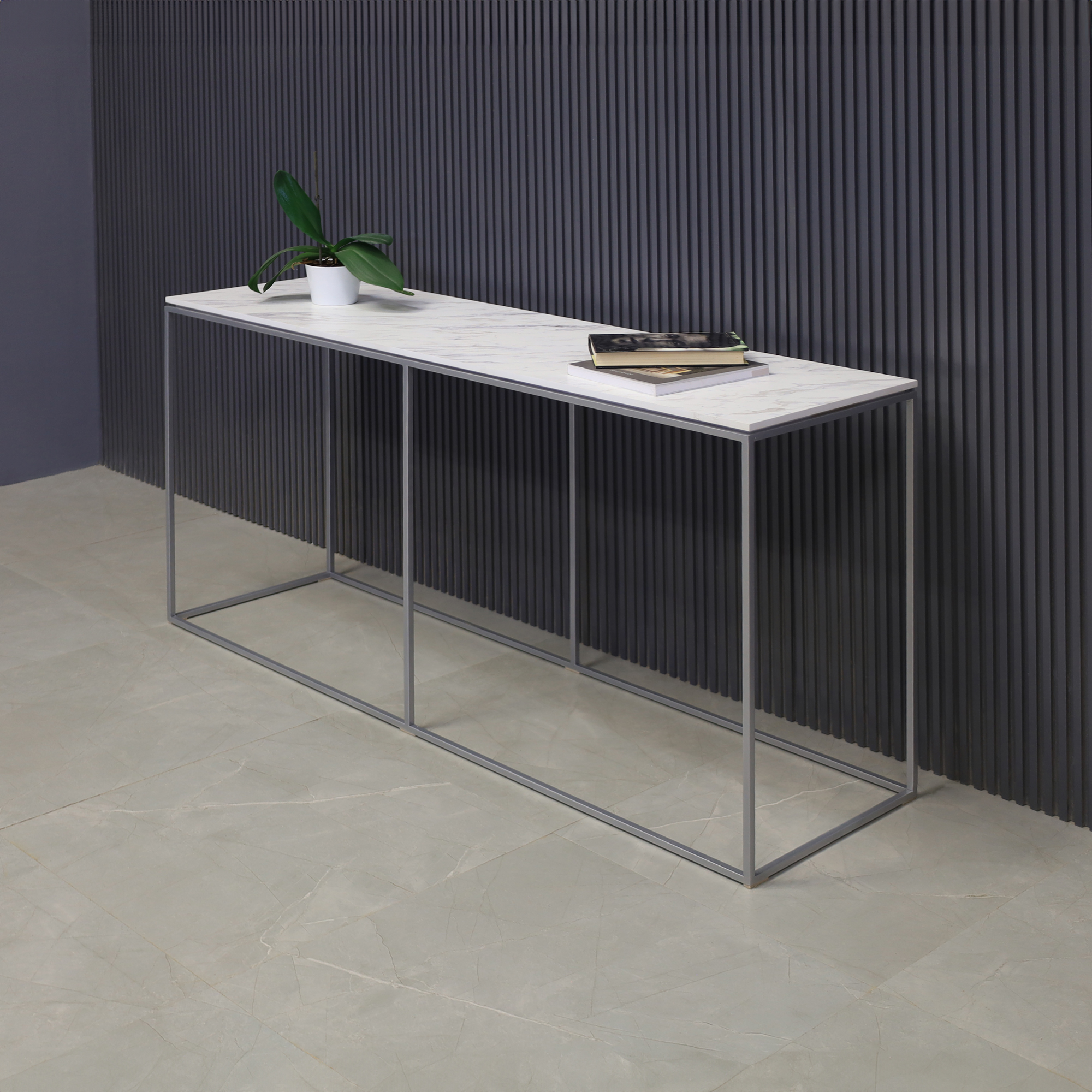 60-inch Aspen Console Table in 1/2" calcutta blanc engineered surface top and silver metal frame, shown here.