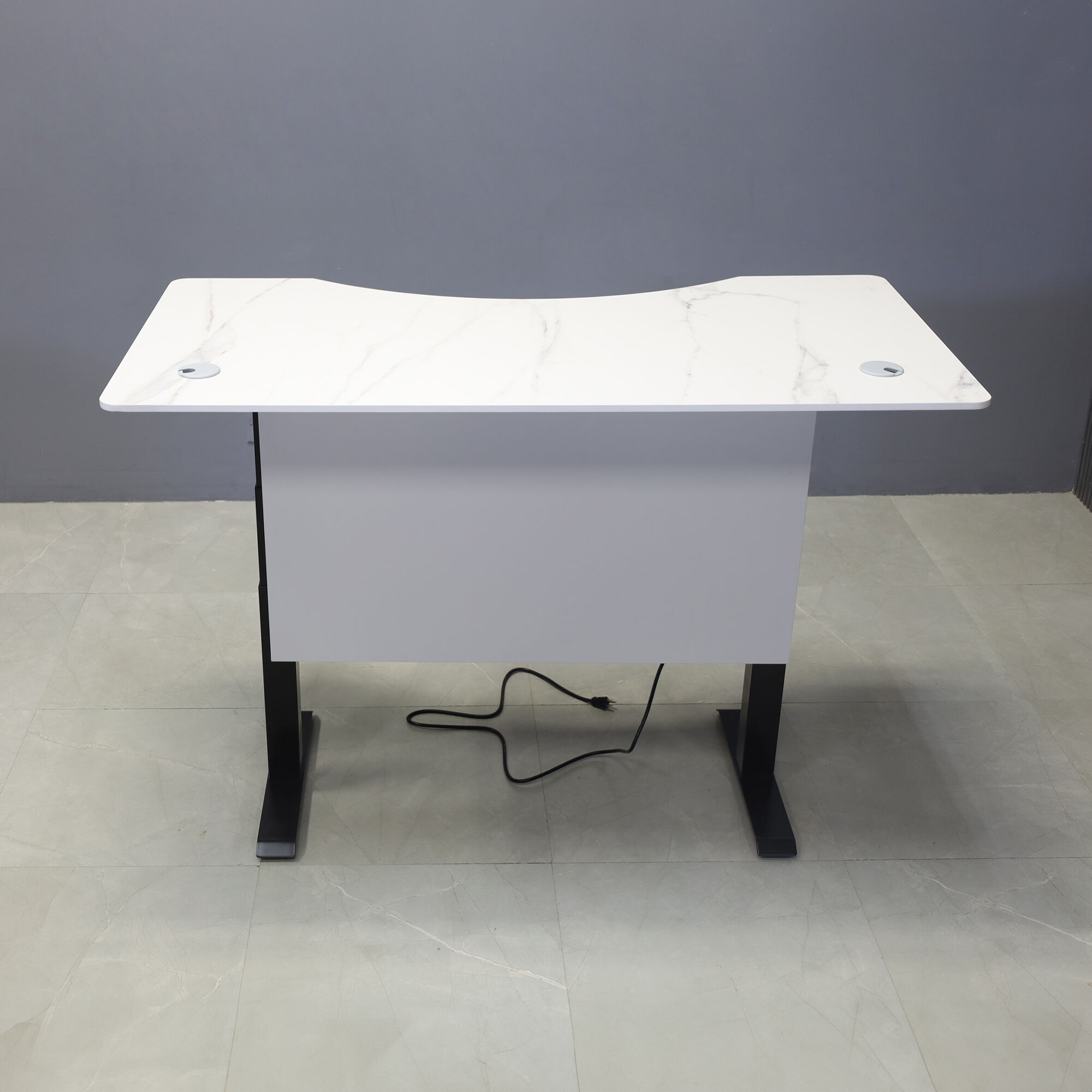 60-inch aXis Sit-stand Executive Desk with 1/2" solenne marble engineered surface top, folkstone gray matte laminate privacy panel and black metal legs, shown here.