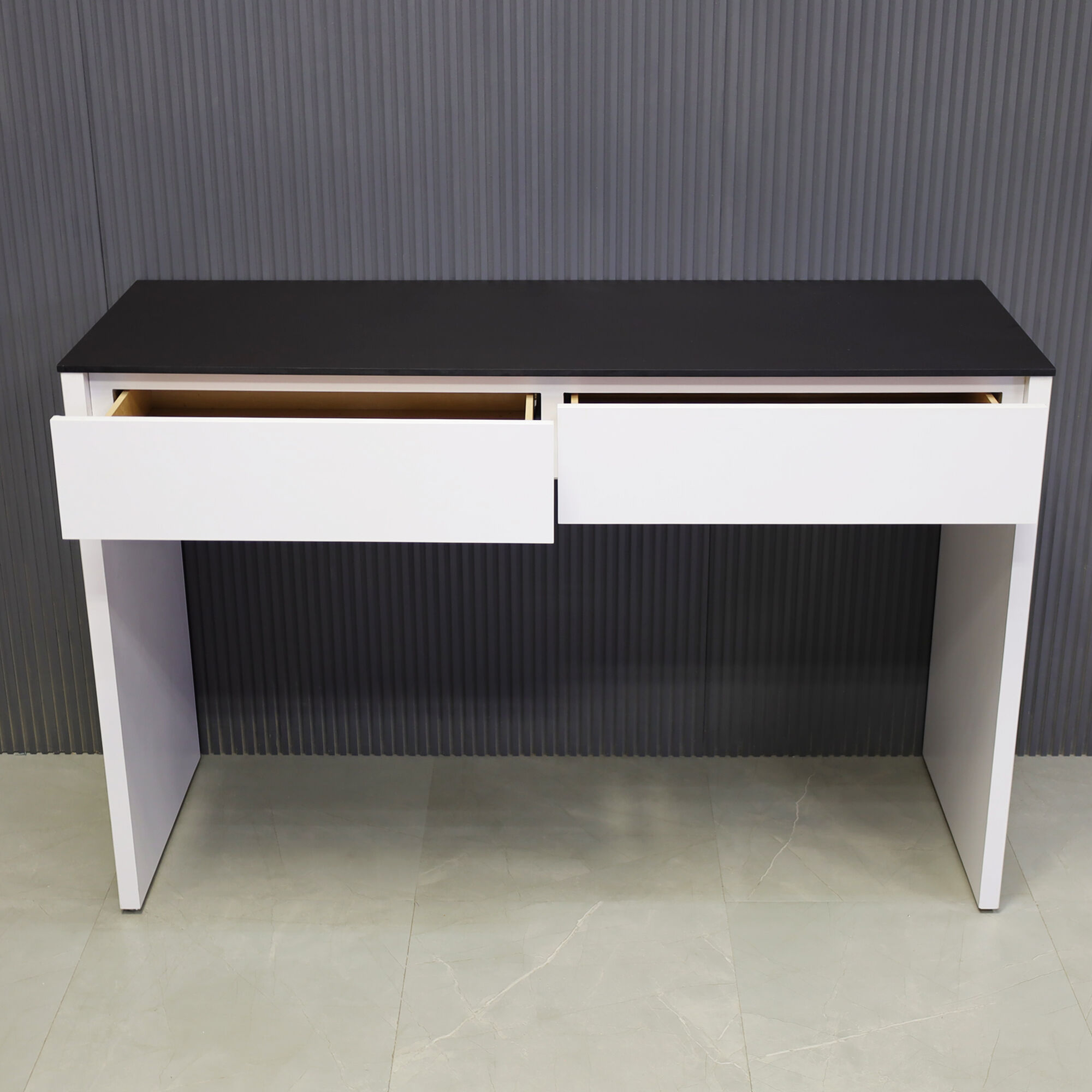 66-inch Ashville Bar Table in 1/2" Black traceless engineered surface top and white matte laminate base with two drawers, shown here.