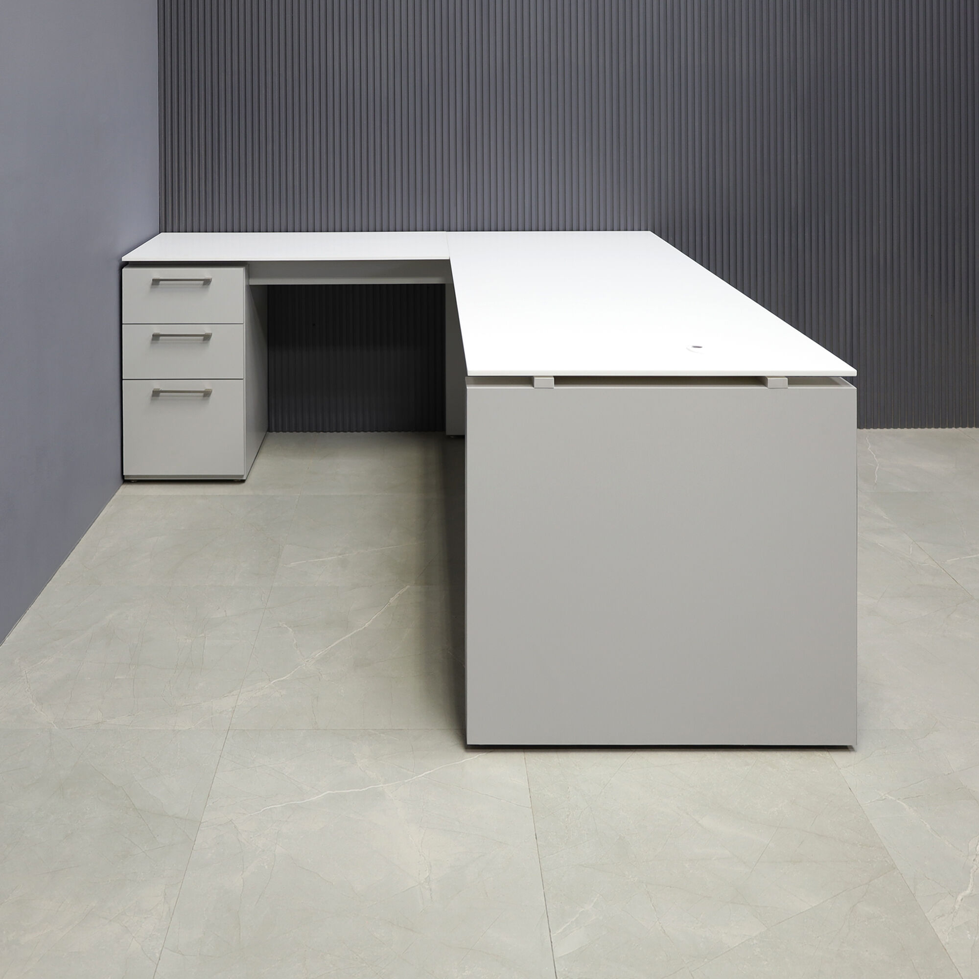 72-inch Denver L-Shape Executive Desk with return & cabinet on left side when sitting, in 1/2" white solid engineered surface top, folkstone gray matte laminate base, cabinet & privacy panel, shown here.