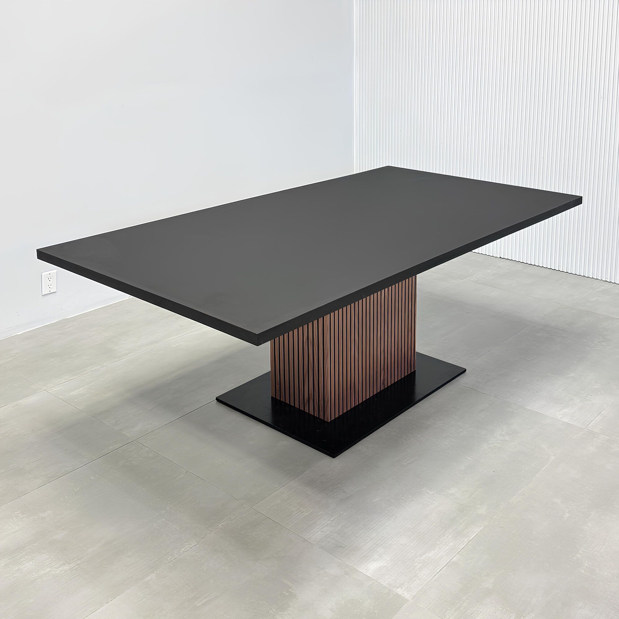 84-inch Newton Rectangular Conference Table with X3 Base with black traceless laminate top, metal powder-coated black base, and walnut tambour with black background pedestal.