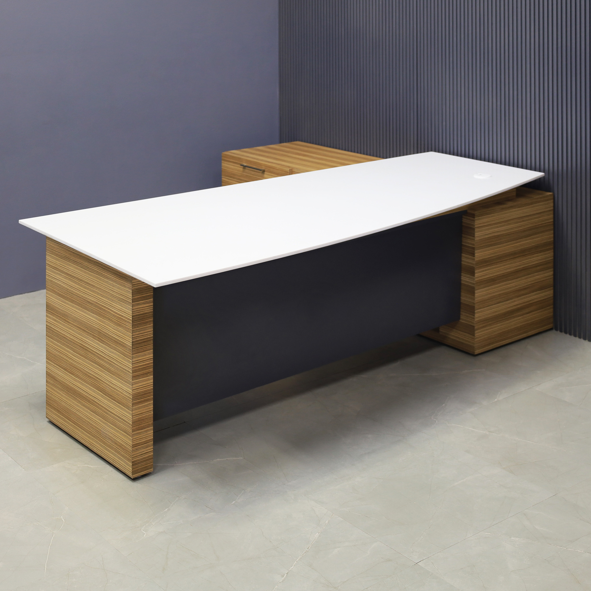 84-inch Avenue Curved Executive Desk with credenza on the left side when sitting, with 1/2" white solid engineered surface top, wood veneer base and credenza, and storm gray matte laminate privacy panel, shown here.