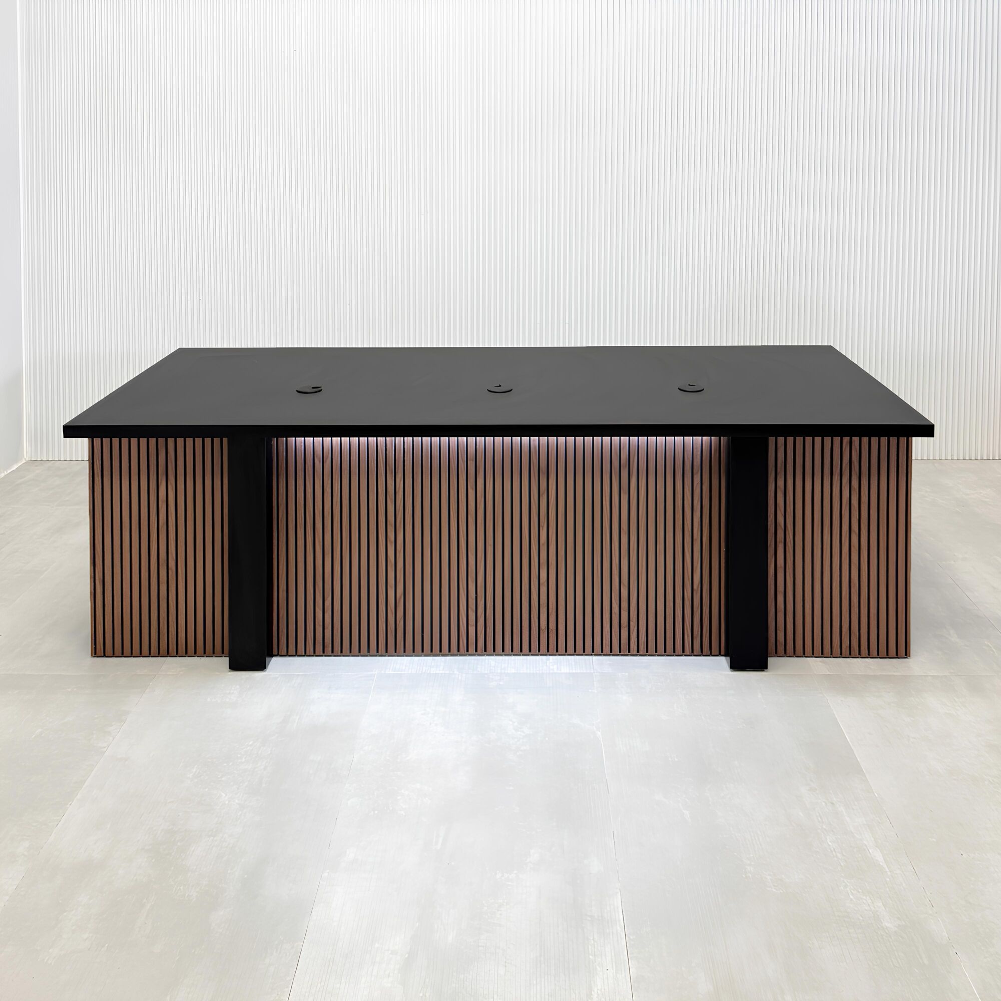 90-inch Savannah Handmade Podcast Table with black matte laminate top, walnut tambour with black background front, black matte laminate base back, white LED.