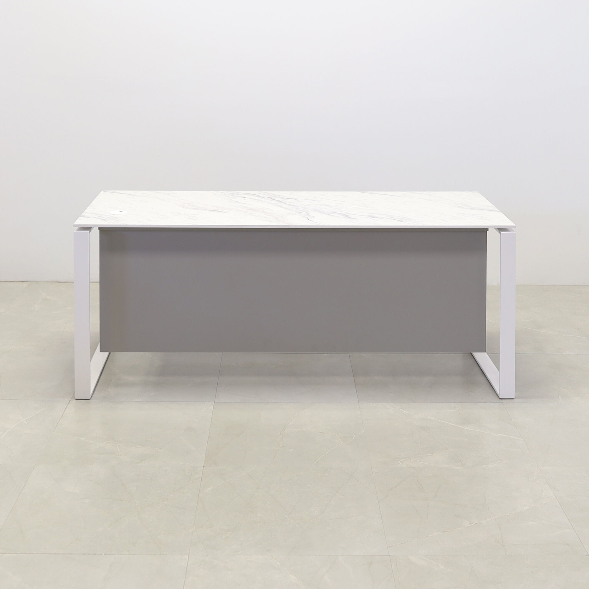 Aspen Straight Executive Desk With 1/2" calcutta blanc engineered surface top, fog gray matte laminate privacy panel, and white metal legs, shown here.