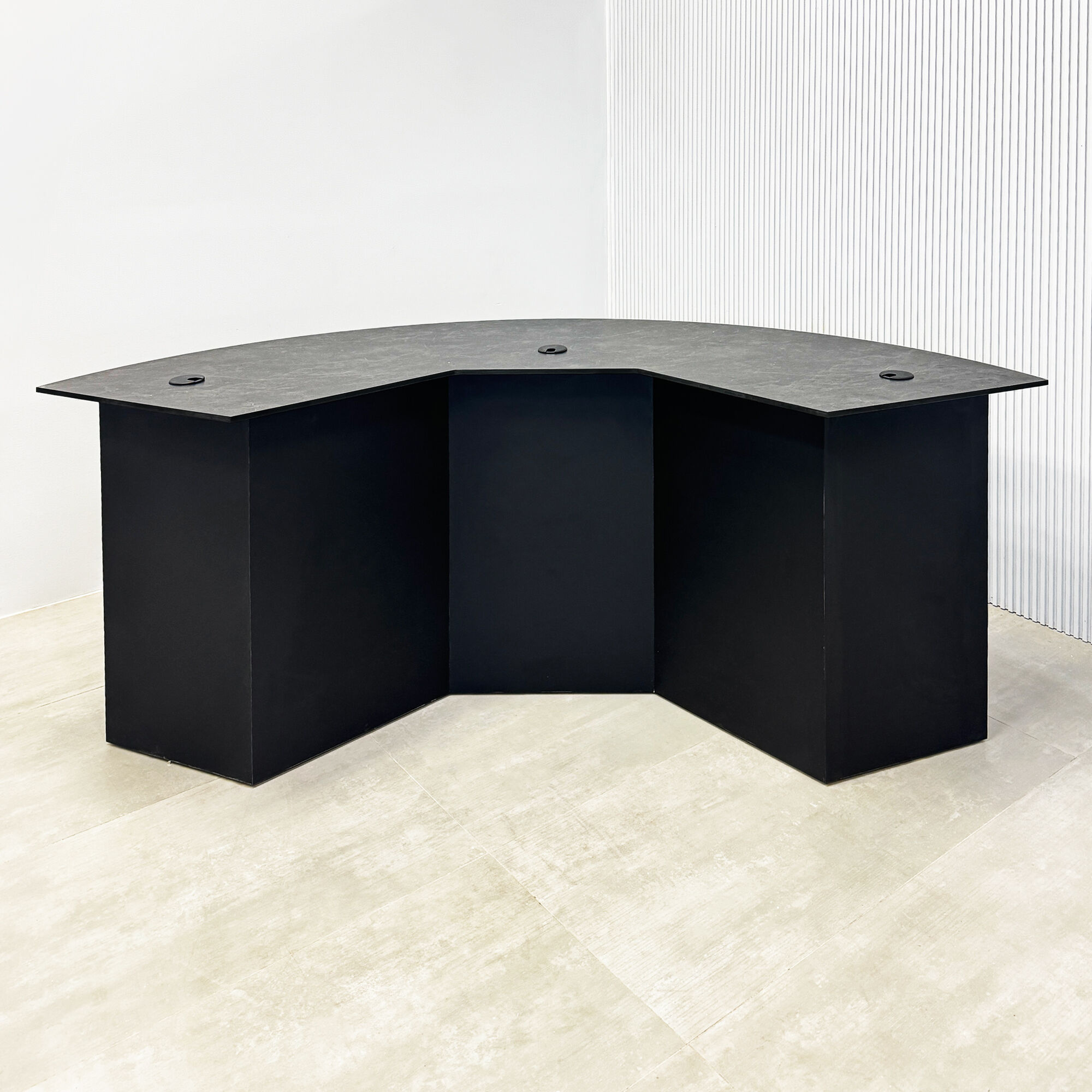 90-inch Tampa Bay Podcast Table with black amani engineered surface top, black traceless laminate front base, and black matte laminate back base.