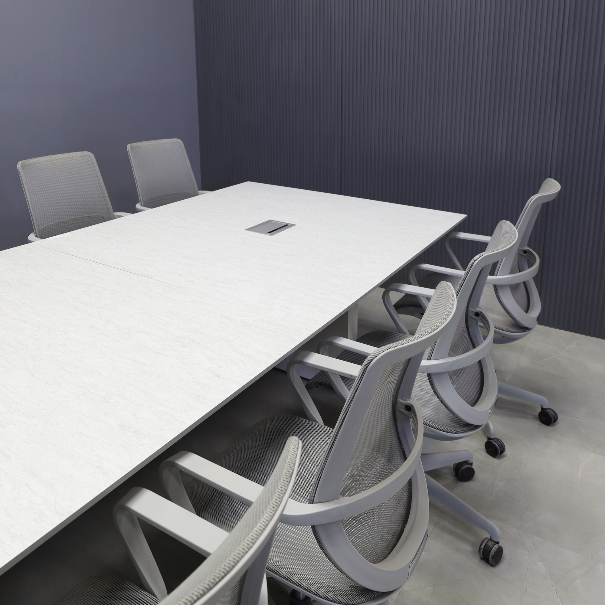 Engineered surface conference table with a rectangular stone-look top